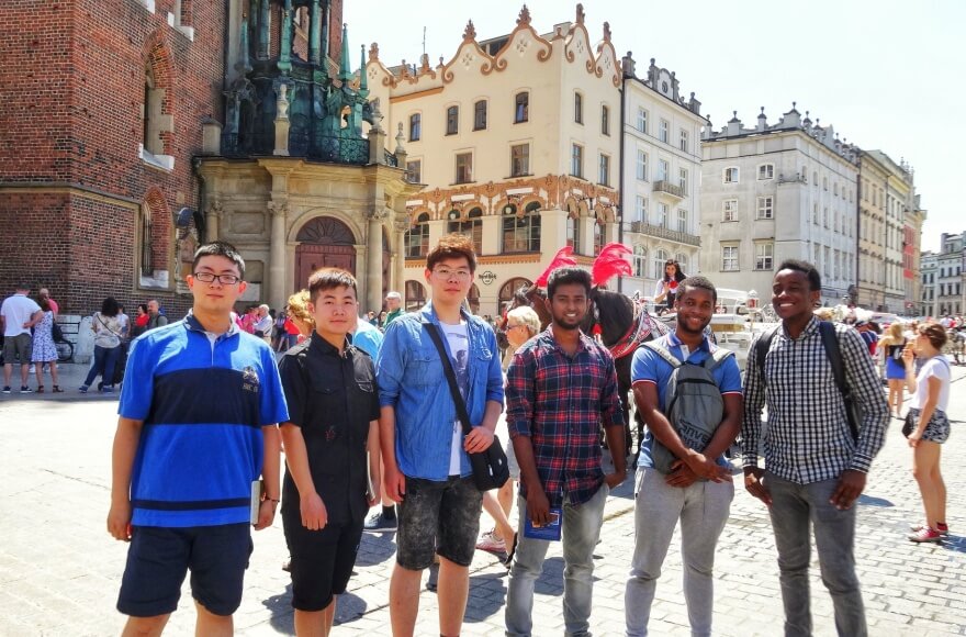 International students on a historic university campus in Poland