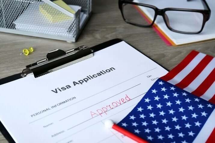 Traveler applying for tourist visa online using laptop