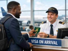 The Ultimate Guide to Visa on Arrival Countries for Nigerians Nigerian traveler getting visa on arrival at airport immigration desk