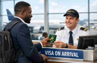 The Ultimate Guide to Visa on Arrival Countries for Nigerians Nigerian traveler getting visa on arrival at airport immigration desk